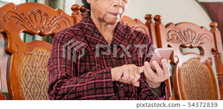 Old man handheld technology technology life style social media elderly smartphone smartphone grandmother smartphone 54372839