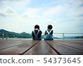 A boy watching the sea 54373645