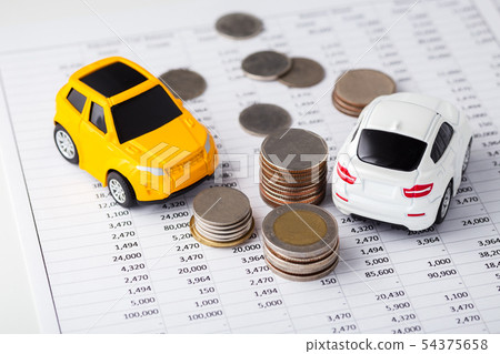 Cars and coins on financial statement 54375658