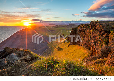 Sunset over cliffs in Vik, Iceland 54376388