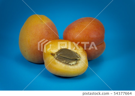 Fresh whole and sliced halved apricots 54377664