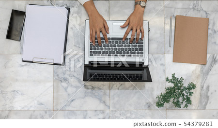 Top view of business woman working with laptop Top view of business woman working with laptop 54379281