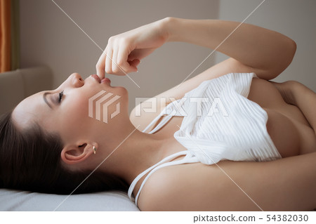 Attractive sensual woman in lingerie on bed in 54382030