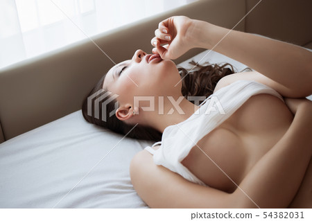 Attractive sensual woman in lingerie on bed in Attractive sensual woman in lingerie on bed in 54382031