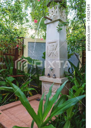Exotic column shower in the open air spa Exotic column shower in the open air spa 54382454