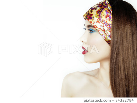 young pretty modern girl with bright shawl on head emotional posing isolated on white background young pretty modern girl with bright shawl on head emotional posing isolated on white background 54382794