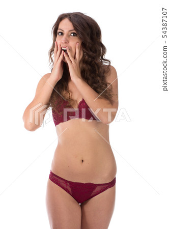 Woman covering her mouth and laughing isolated Woman covering her mouth and laughing isolated 54387107