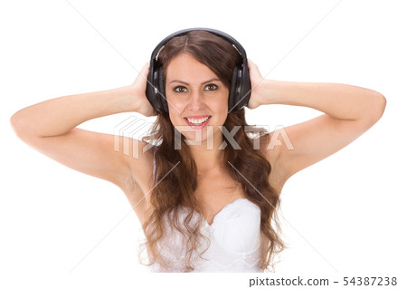 Attractive Sexy woman with beautiful body posing with headphones. Attractive Sexy woman with beautiful body posing with headphones. 54387238