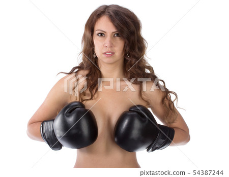Sexy young brunette woman with black boxing gloves covering breasts Sexy young brunette woman with black boxing gloves covering breasts 54387244