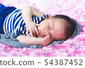 sleeping newborn baby on a blanket 54387452
