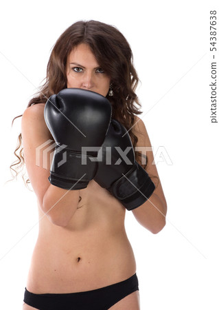 Sexy young brunette woman with black boxing gloves covering breasts Sexy young brunette woman with black boxing gloves covering breasts 54387638