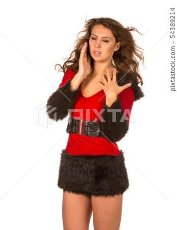 Girl in a New Year's suit struggling with the wind 54389214
