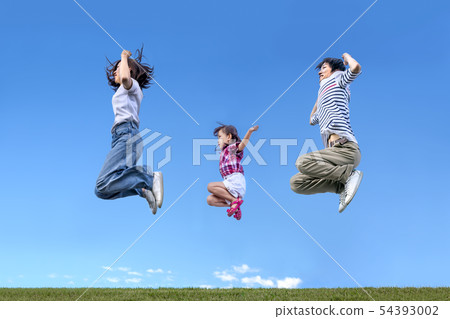 A family jumping together with their parents on a background of blue sky. Jealousy, loving, happy, leap, future image 54393002