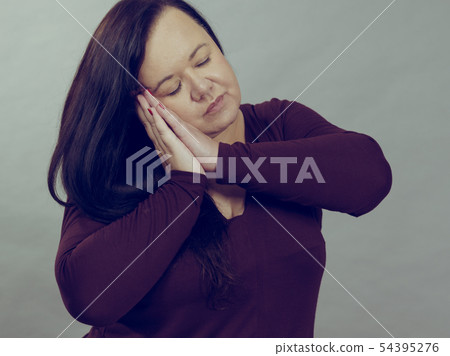 Woman being sleepy gesturing 54395276