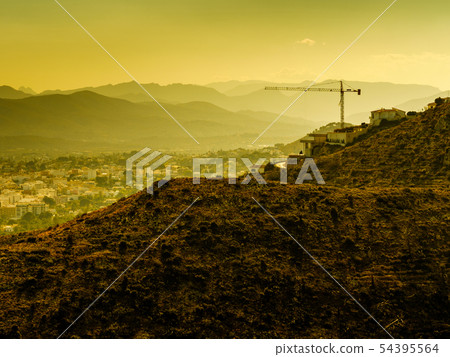 Construction site with crane. Spanish coast. 54395564