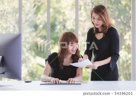 TWO BUSINESS LADIES IN OFFICE TWO BUSINESS LADIES IN OFFICE 54396201