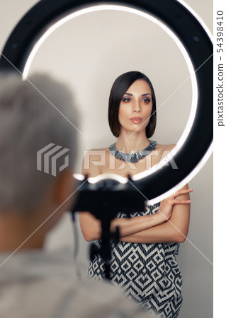 Makeup artist bsn photographs on a mobile phone Makeup artist bsn photographs on a mobile phone 54398410