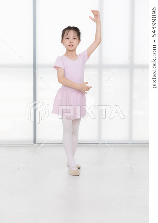 Pink dressed Asian girl in a ballet pose.. 54399096