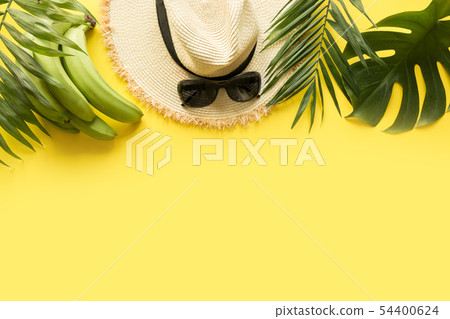 Sun straw beach hat with eyeglasses on yellow. Sun straw beach hat with eyeglasses on yellow. 54400624