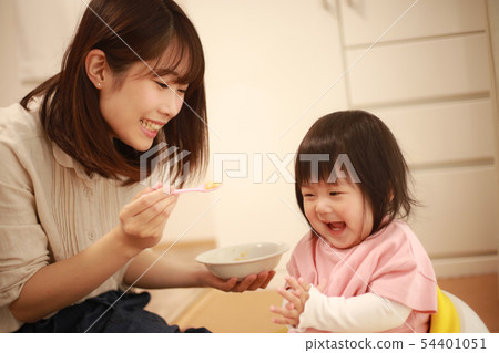 Baby eating baby food 54401051
