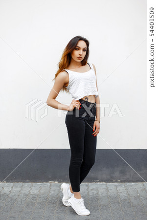 Stylish beautiful girl in a white top T-shirt Stylish beautiful girl in a white top T-shirt 54401509