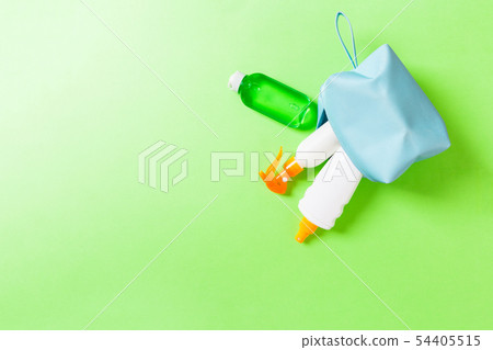 Top view of female cosmetics bag full of suncream Top view of female cosmetics bag full of suncream 54405515