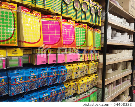 Stationery is packed and hung on display racks 54408328