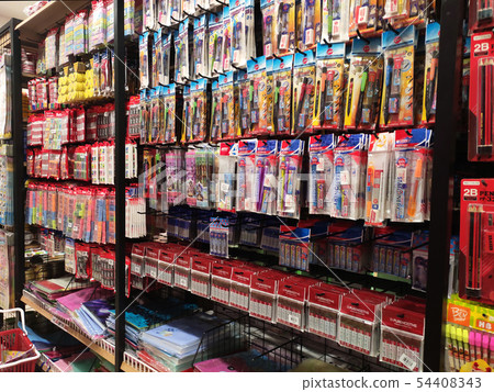 Stationery is packed and hung on display racks 54408343