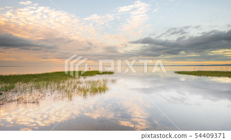 Reflections on a becalmed Lough Neagh  54409371