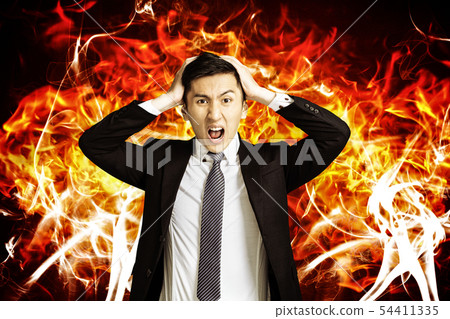 angry young business man with burning fire angry young business man with burning fire 54411335