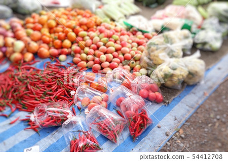 Shops selling vegetables at the market Shops selling vegetables at the market 54412708