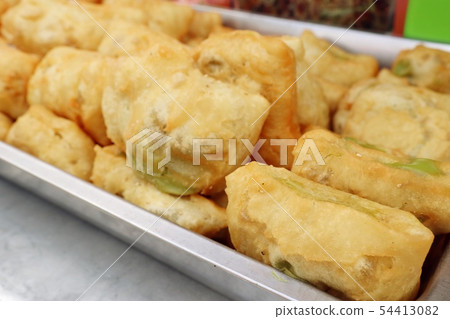 Deep-fried dough stick at market 54413082