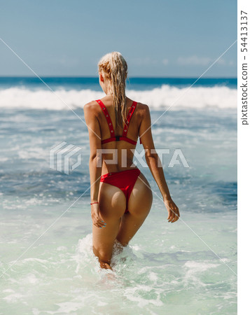Attractive young woman in bikini relax at beach 54413137