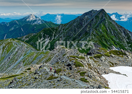 Mountain climber going along the vertical runway of Southern Alps and Mt. Nodoka, and the view of Kitadake and Kaikomagadake 54415871