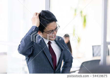 Worried businessman 54419675