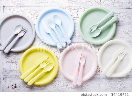 Colorful plastic dishes for summer picnic 54419731