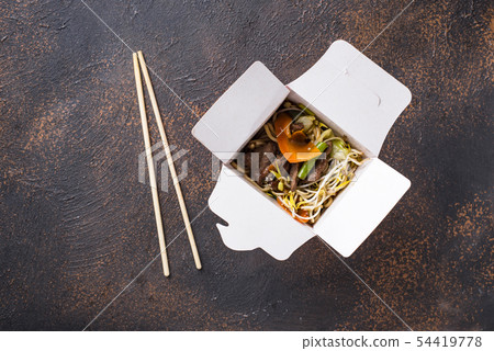 Asian noodles with meat and vegetables 54419778