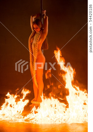 Gorgeous nude girl on pylon in fire shot 54420186