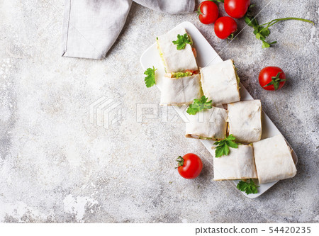 Lavash rolls with chicken and vegetables Lavash rolls with chicken and vegetables 54420235