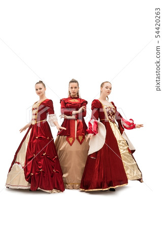 Three girls in gorgeous queen red dresses 54420263