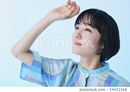 Woman wearing a blue dress Woman wearing a blue dress 54421568