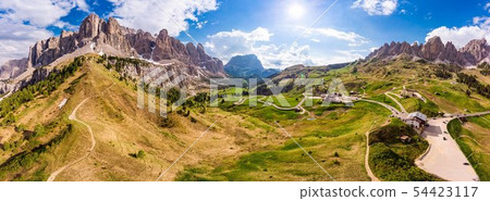 Dolomites - Beautiful panoramic sunset landscape at Gardena Pass (Passo Giau) near Ortisei. Stunning Dolomites - Beautiful panoramic sunset landscape at Gardena Pass (Passo Giau) near Ortisei. Stunning 54423117