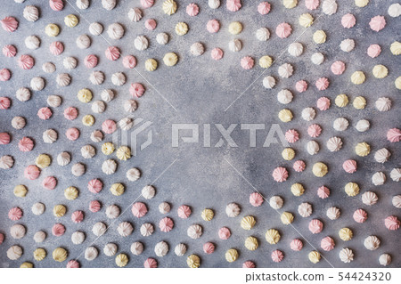 Small home meringue laid out on a gray table Small home meringue laid out on a gray table 54424320