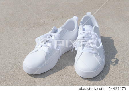 Beach and white sneakers Beach and white sneakers 54424473