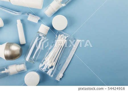 Travel small bottle set on blue background. Top Travel small bottle set on blue background. Top 54424916