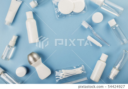 Travel small bottle set on blue background. Top 54424927