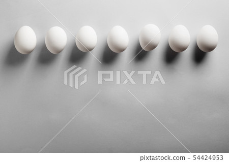 White eggs deep shadows on gray background. Top 54424953