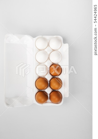 Group of raw eggs white and brown. Concept of 54424965