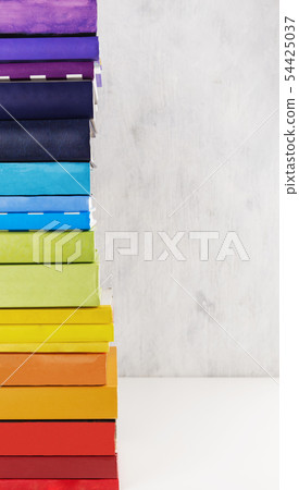 Stack of colorful rainbow books on white Stack of colorful rainbow books on white 54425037