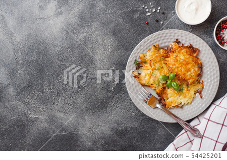 Fried cakes of grated potatoes on the plate 54425201